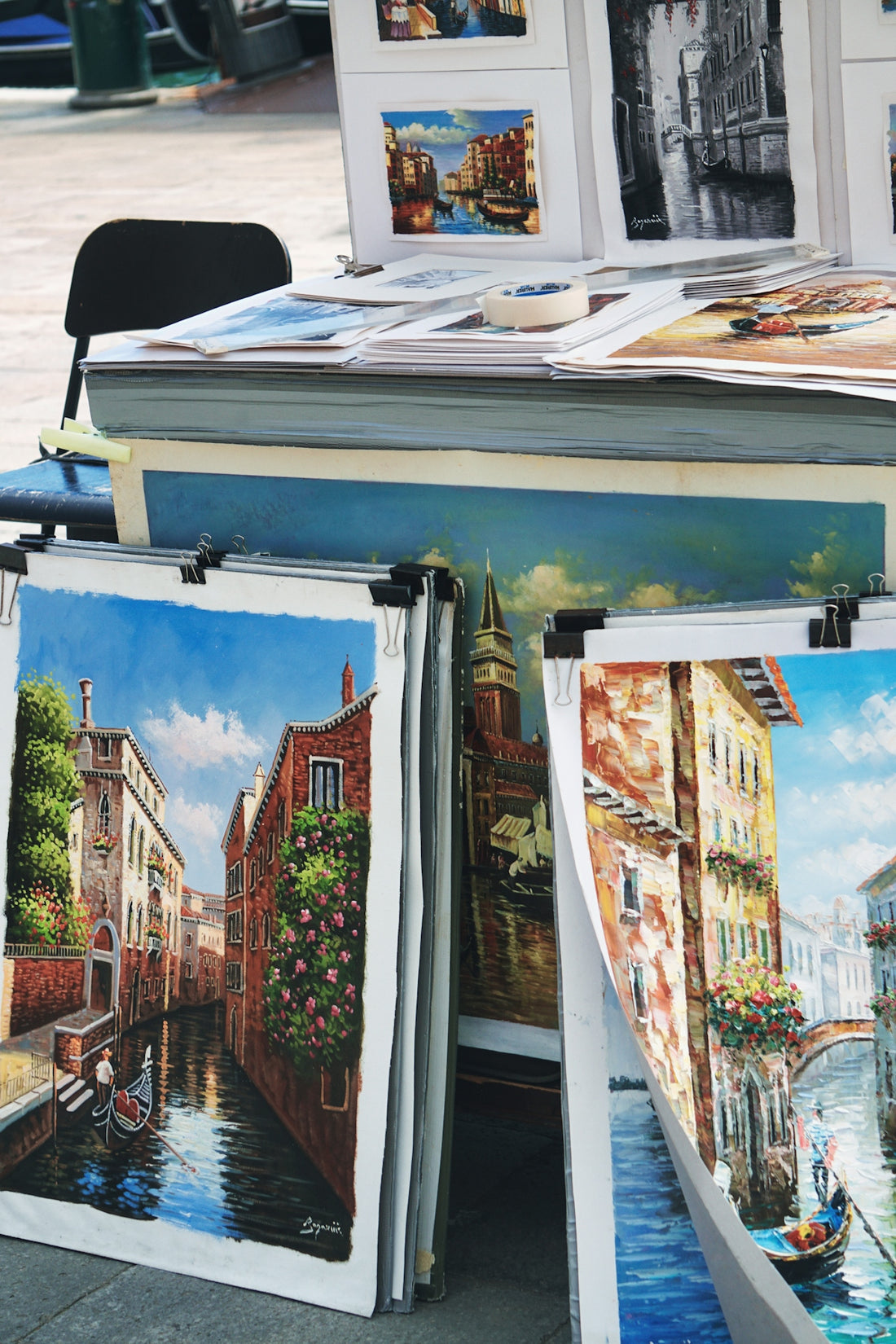 a bunch of paintings are on a table