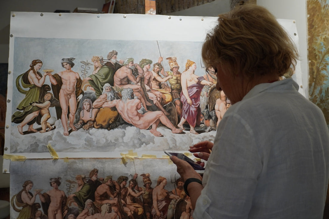 A woman standing in front of a painting