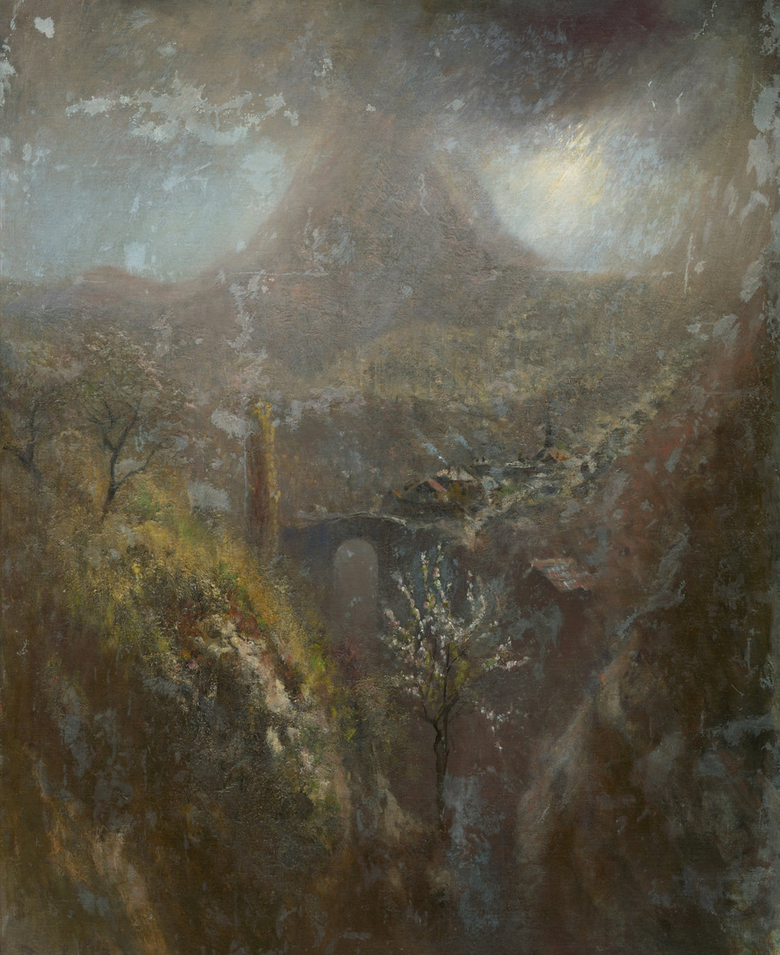 A dramatic landscape with a mountain and bridge.